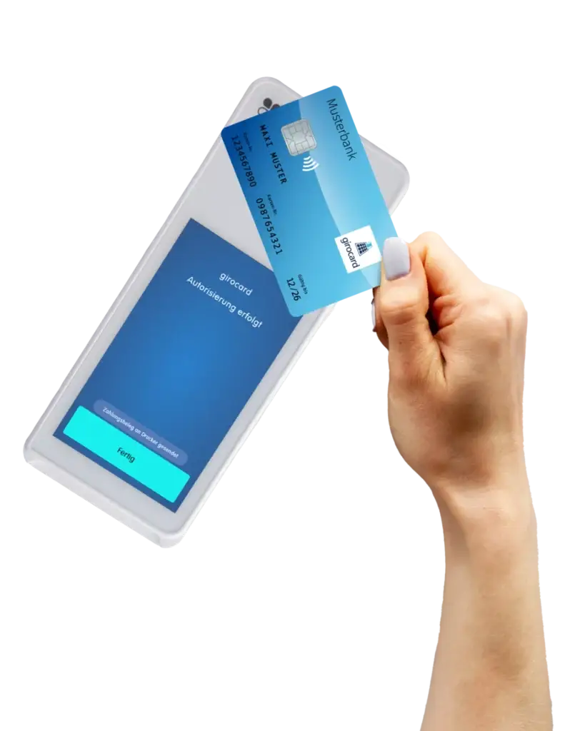 Hand hält eine girocard über ein Smartphone-Display, auf dem die Nachricht "Autorisierung erfolgt" angezeigt wird, was den kontaktlosen Zahlungsprozess darstellt.