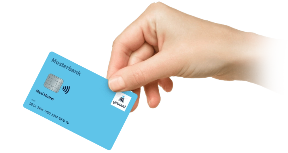 Eine Hand hält eine blaue girocard der Musterbank.